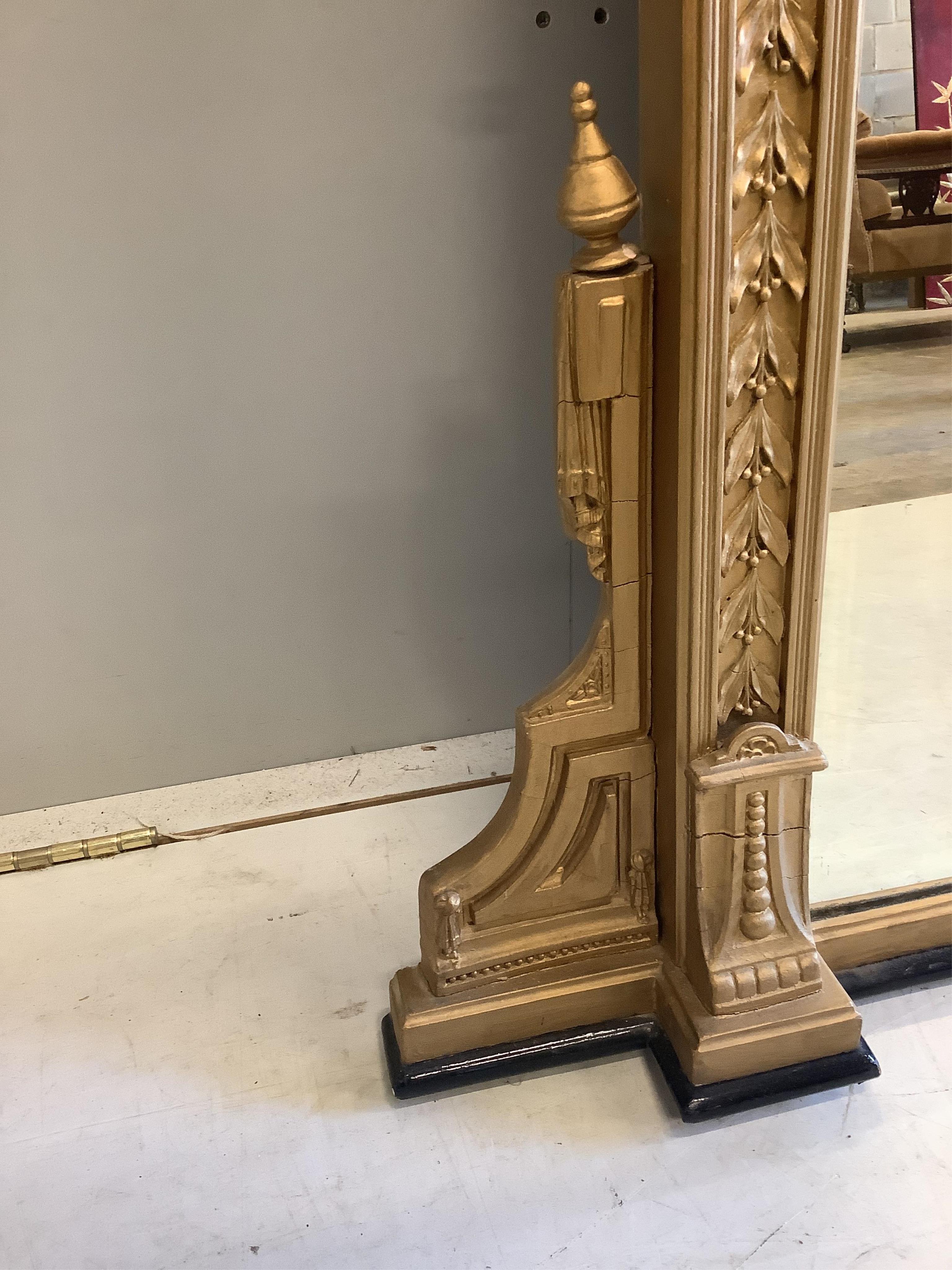 A Victorian giltwood and composition overmantel mirror, width 146cm, height 160cm. Condition - fair, re-gilded